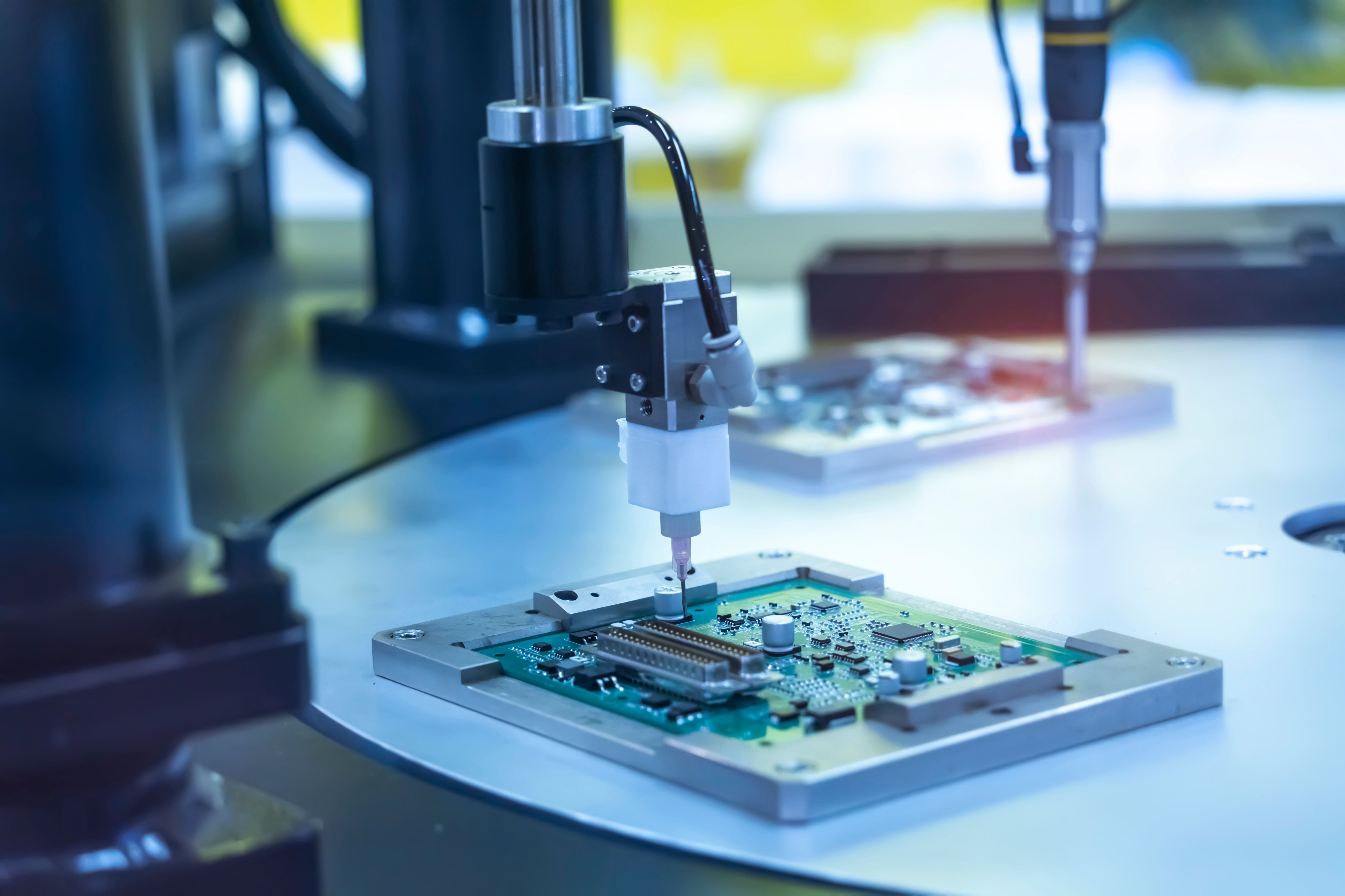 Robot Holding Glue Syringe Injection on Pcb_5184x3456