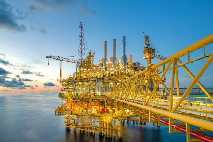 Bright yellow oil and gas rig in the ocean Bright yellow oil and gas rig in the ocean