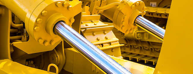 Bright yellow machine with hydraulics