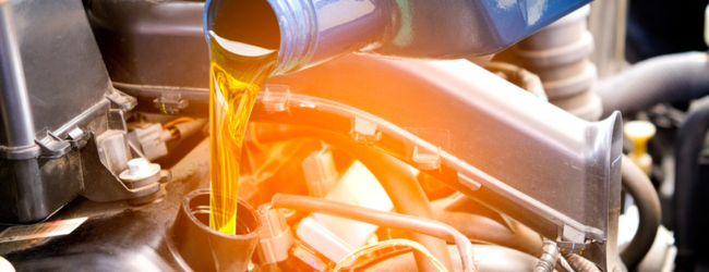 Pouring oil into an engine