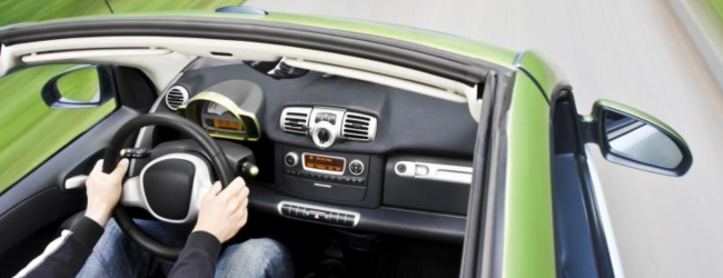 Person driving convertible car